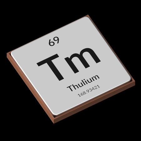 Embossed isolated metal plate displaying the chemical element Thulium, its atomic weight, periodic number, and symbol on a black background. This image is a 3d render.の写真素材