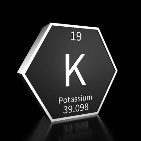 Metal hexagonal block representing the periodic table element Potassium. Presented as white text on a black backing plate with a black background. This image is a 3d render.の写真素材