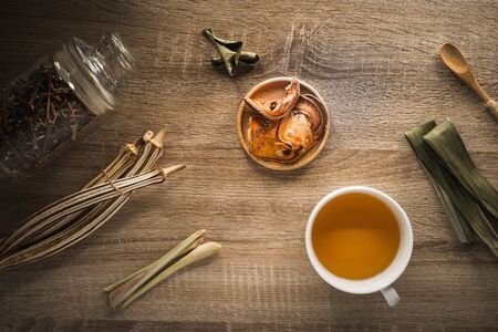 Cup of herbal tea on wooden tableの写真素材