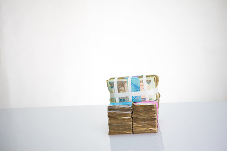 Stack of nigeria naira notes on white backgroundの写真素材