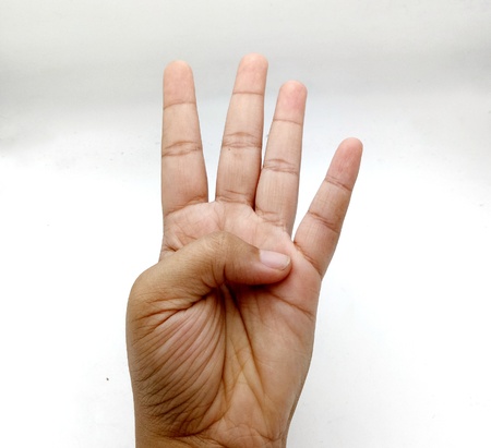 Hand  number four on white backgroundの写真素材