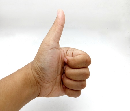 Man hand make good on white background.の写真素材