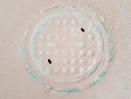 old sewer manhole painted red