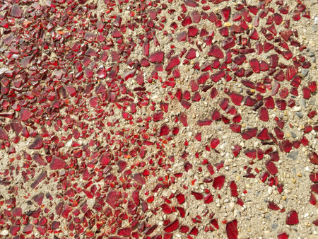broken red glass in cementの写真素材
