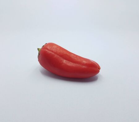 crisp red pepper vegetable on white background