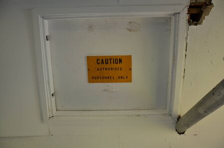 caution authorized personnel only sign on attic entrance