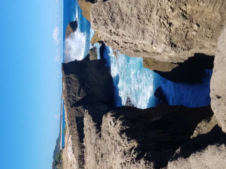 rocky shore with ocean water in Isabela, Puerto Rico