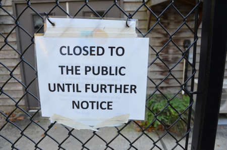 closed to the public until further notice sign on fenceの写真素材