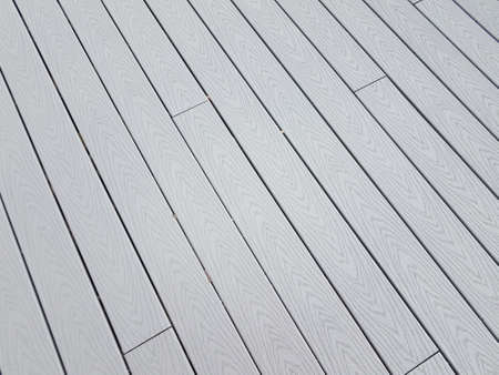 grey artificial or composite wood boards on deck with lines