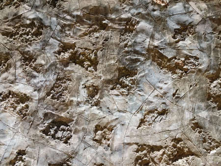 grey stone or rock wall with rough textureの写真素材