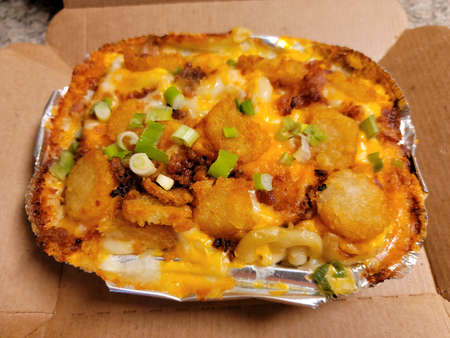 macaroni and cheese pasta with tater tots and onion