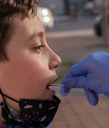 child getting tested for covid-19