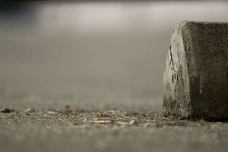 Parking block in an empty parking spaceの写真素材