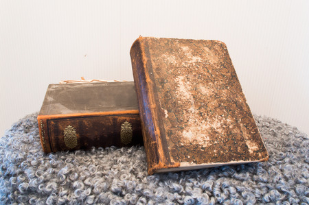 Old books in carpet on tableの写真素材