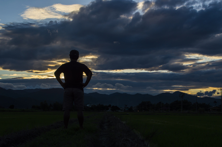 Man silhouette,Moments of the man's joy. On the Nature sunsetの写真素材