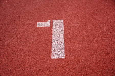Number one on the start of a running trackの写真素材
