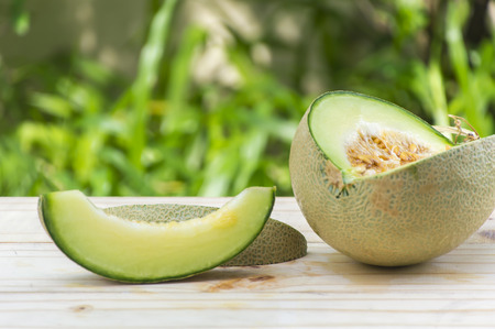 Ripe sweet melon on table in garden