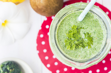 Healthy green smoothie with spinach,kiwi and lemon.の写真素材