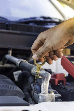 Auto mechanic uses hand of technician checking or fixing engine of in a car,Selective focus.の写真素材