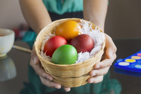 Close up of colorful Easter eggs in a basket.Easter concept.