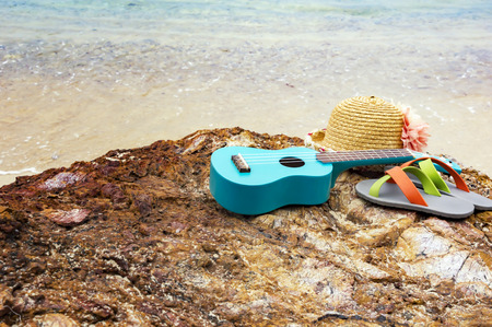Women's accessories for the beach lying on the rock, with place for your text.Copy space.の写真素材