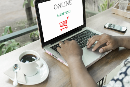 Young man using laptop computer. Online shopping conceptの写真素材