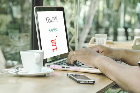 Young man using laptop computer. Online shopping conceptの写真素材