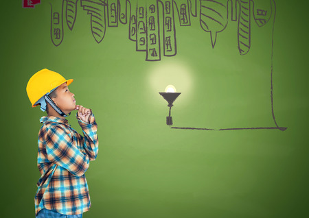 Little boy engineering with creative drawing of cities. Concept of a small creative engineer.の写真素材