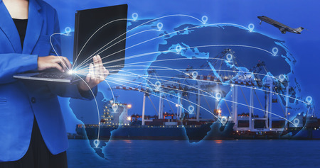 Bussiness woman working online goods orders on laptop, Logistic and transport concept in front...