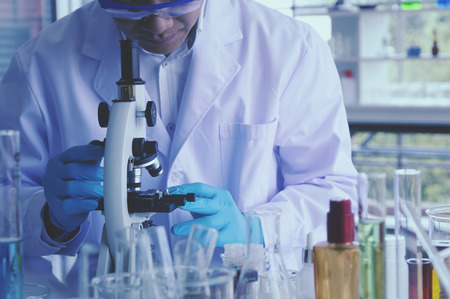 Health care researchers working in life science laboratory. Male supervisor preparing and analyzing...