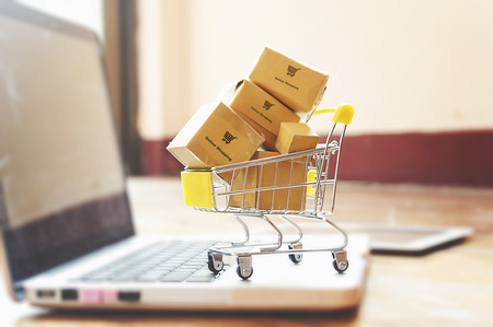 Boxes in a trolley on a laptop keyboard. Ideas about online shopping, online shopping is a form of...