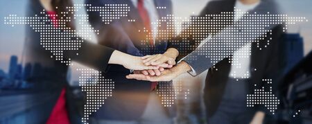 Teamwork of business handshake for successful of investment deal and city night background, teamwork and partnership concept.の写真素材
