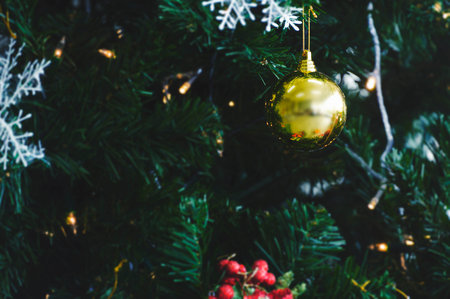 Decorated Christmas tree on blurred, sparkling and fairy backgroundの写真素材