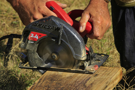 Skill Saw cutting a board