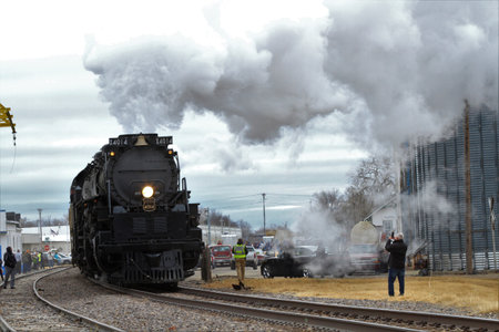 A shot of Big Boy 4014 in Ellsworth Kansas with smoke and steam on an over cast winter day. Which...
