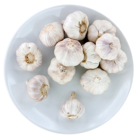 Organic garlic whole and cloves on the wooden backgroundの写真素材