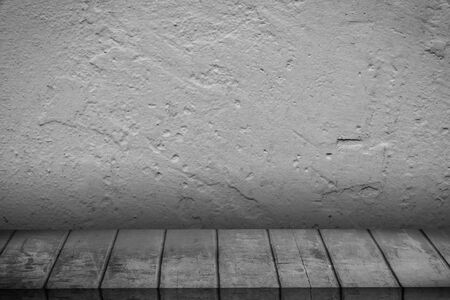 wooden table in front of wall roomの写真素材