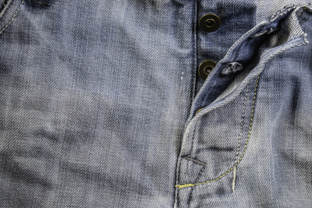 Old grunge vintage denim jeans. Stitched texture denim jeans background of jeans fashion design.の写真素材