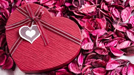 red heart shaped gift box on flowers background,Concept for valentine day.