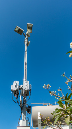 Lamp with wireless network on blue sky background.の写真素材