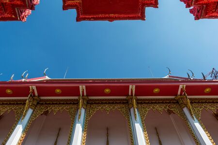 Temple roof vintage Thai style with against blue sky background - Art architecture Temple roof of...