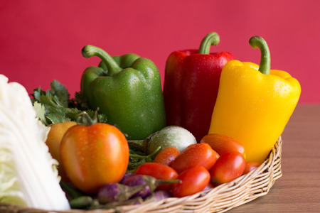 Peppers -  Group of bell peppers vegetable in the vintage basket . Pepper is vegetable that can be used to cooking. Close upの写真素材