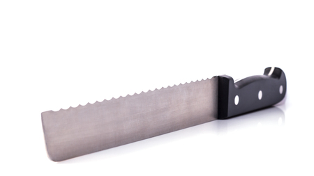 Kitchen knife - High-quality bread knife isolated with soft shadows on a pure white background....