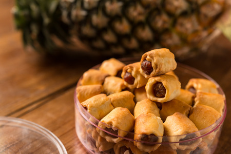 Pineapple tarts cookies, Freshly baked pineapple tarts cookies on wooden background.の写真素材
