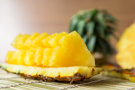 Pineapple with slices - Fresh of pineapple slices Asian-style on the bamboo place mats background....