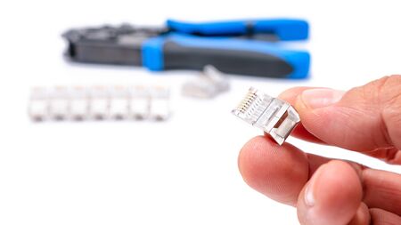 Crimping tool isolated on white background, use for twisted pair network cable with handful of RJ-45 connector.の写真素材