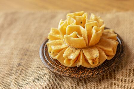 Crispy lotus blossom cookies isolated on white. Thai traditional snack. Top view. Thai homemade...
