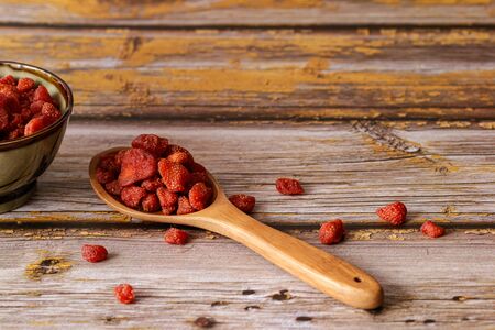 Dried fruits, Strawberry in wooden ladle on vintage wooden backgrounds. Copy space., Selective focus