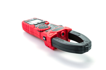 Testing electric digital clamp meter isolated on white background.