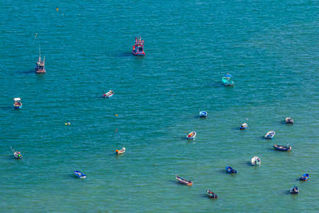 Parasailing boat with Parachute on Pattaya Beach on a holiday at Pattaya city, Thailand.